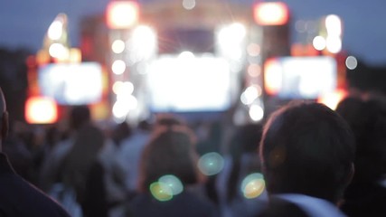 Youth at pop musician concert, perfomance. Many people dancing, have fun, enjoy