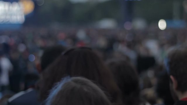 Enormous quantity of people singer concert, crowd looking forward to seeing star