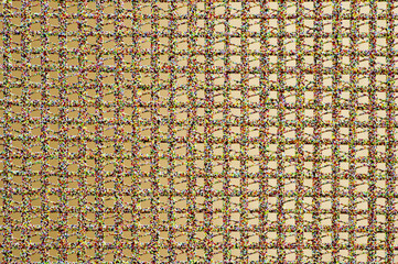 The texture of the background of a synthetic textile in the form of a square lattice