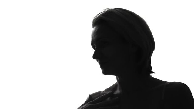 Smiling, attractive, beautiful woman's silhouette is flirting with, luring