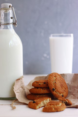 cookies with milk. healthy breakfast. bottle of milk with milk glass