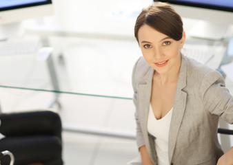 view from the top. two women colleagues sitting near the desktop