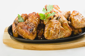 chicken wings with sesame on white background