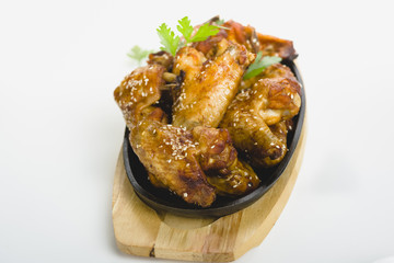 chicken wings with sesame on white background