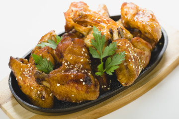 chicken wings with sesame on white background
