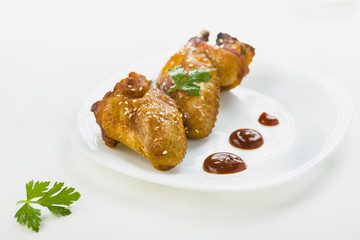 chicken wings with sesame on white background