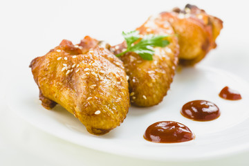chicken wings with sesame on white background