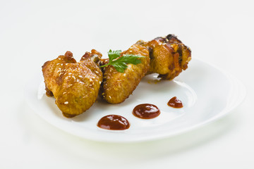 chicken wings with sesame on white background