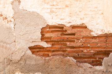 Damaged wall with red  brick part showing closeup, background/ texture.