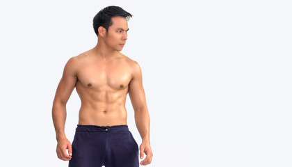 Fototapeta premium Muscular athlete bodybuilder man with copy space isolated on white background. Healthy sport Concept