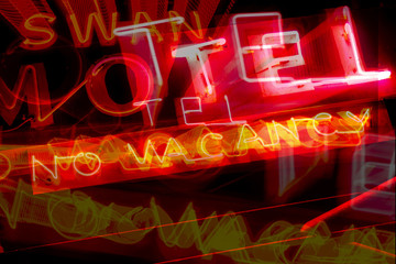Abstract combined exposures of neon motel no-vacancy sign at night