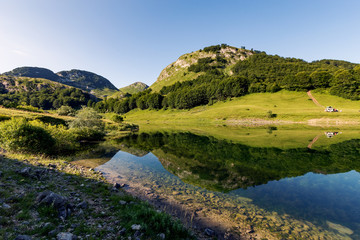 Fototapeta na wymiar Beautiful mountain reflection on lake.Crystal clear reflection of mountains in the lake