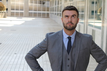 Fed up businessman rolling his eyes