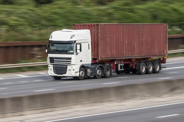 Container lorry in motion on the motorway