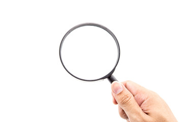 Hand holding magnifying glass on white background.