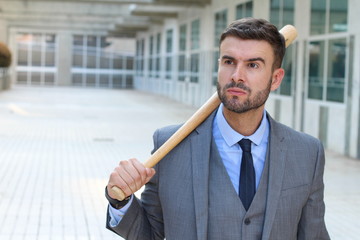Angry businessman holding baseball bat