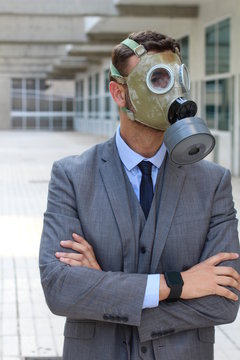 Apocalyptical image of businessman wearing gas mask