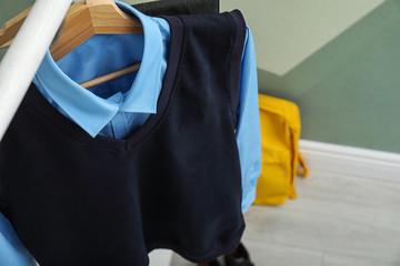 School uniform for boy on rack indoors