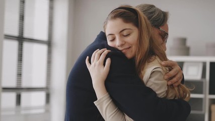 Girl hugging her father with love