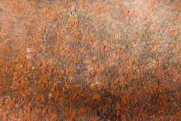 Red and brown rusty metal texture on porous surface. Texture of rust, copper patina corrosion.