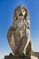 Sculpture of a lion on the Scheldt River