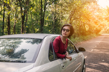 Young beautiful hipster woman driving leisure activity concept.