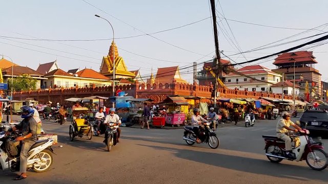 Busy Motorbike traffic at intersection in Cambodia