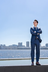 portrait of asian businessman in blue sky