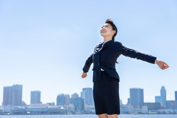 portrait of asian businesswoman in blue sky