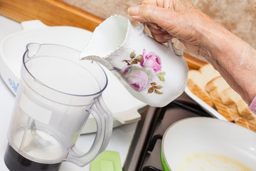 French toast preparation: Adding ingredients to prepare the mix to soak bread for french toasts
