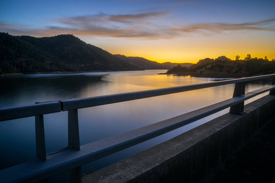 Beautiful Don Pedro Lake, Through a Bridge Guardrail at Sunset