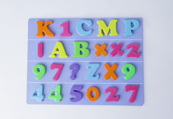 plastic magnetic colored english alphabet on blue background