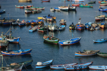Fototapeta na wymiar LIma, Peru: Boats in traditional fisher harbor of Pucusana.