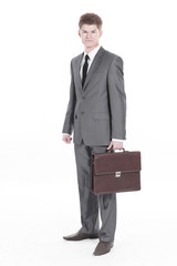 in full growth.young businessman with a leather briefcase.