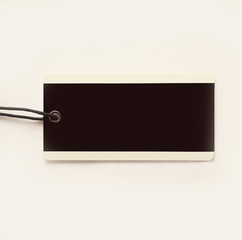 blank decorative tag made of cardboard on a white