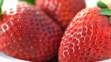 Macro closeup of summertime fresh strawberry fruit
