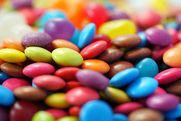 Fototapeta na wymiar Macro closeup of multi color candy and jellies, colorful background.