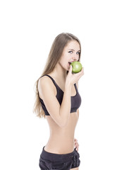 concept of a healthy lifestyle: portrait of a female fitness instructor with an Apple in his hand