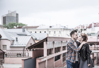 love couple kissing on the street of a modern city.