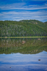 Sparks Lake in Central Oregon USA reflecting pine trees in the water