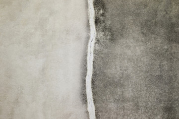 Concrete old wall with the remains of putty and mortar. Background, texture.