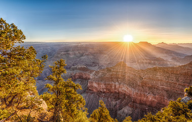 Sunrise. First Rays of Sun over Grand Canyon from Mather Point.
