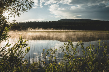 Sunrise over lake early morning mist nature landscape photography