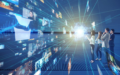 Group of people looking stereoscopic display.