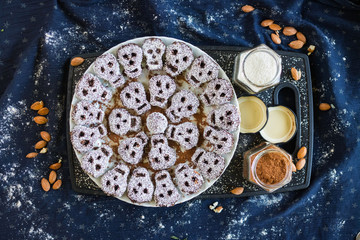 Sweet skull shaped vegan sweets - coconut, cocoa, dates and walnuts - for halloween party or kids healthy breakfast. Raw vegan vegetarian food.