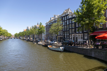 Fototapeta na wymiar The embankment of the Amstel River in the center of Amsterdam