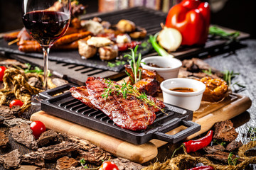 Arabian cuisine in Dubai. A roasted beef steak, with sauce, on a wooden board. The concept is a beautiful serve in the restaurant. Background image. Copy space, selective focus