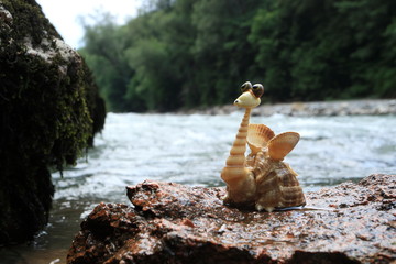 Image of a dragon made of shells. Handmade.
