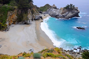 Famous waterfall on the beach in Big Sur, California, United States