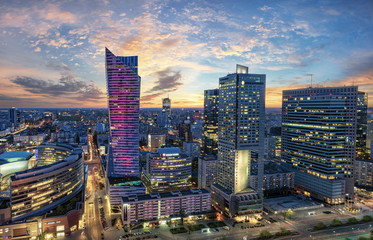 Naklejka na ściany i meble Warsaw city with modern skyscraper at sunset-Panorama